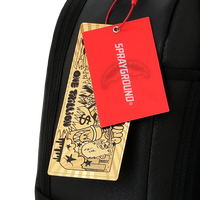 BLACKED OUT EMBOSSED GOLD TOOTH DLXSV BACKPACK
